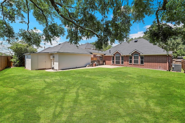 16503 Torry View Ter, Houston, TX 77095 - rear view of property with a patio, central AC unit, brick siding, and an outbuilding