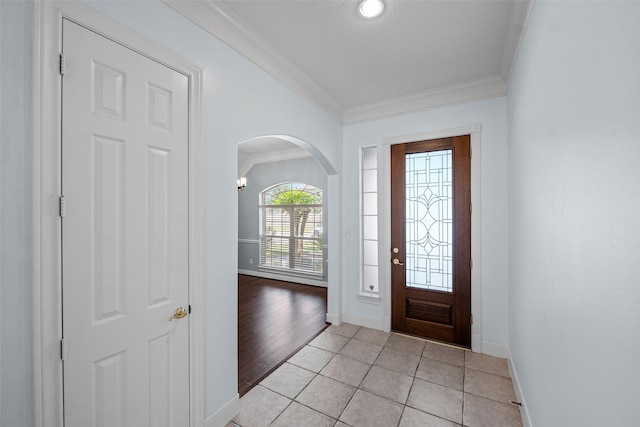 16503 Torry View Ter, Houston, TX 77095 - entrance foyer with arched walkways, crown molding, baseboards, and light tile patterned floors