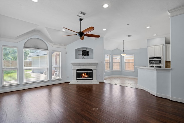16503 Torry View Ter, Houston, TX 77095 - unfurnished living room featuring ceiling fan, lofted ceiling, a high end fireplace, recessed lighting, and hardwood / wood-style floors