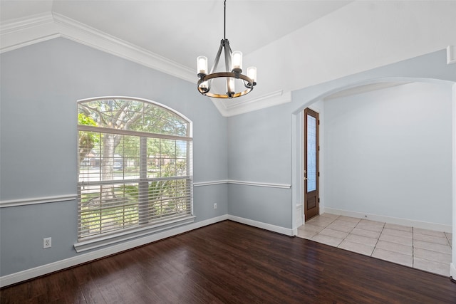 16503 Torry View Ter, Houston, TX 77095 - empty room with vaulted ceiling, arched walkways, a chandelier, ornamental molding, and wood finished floors