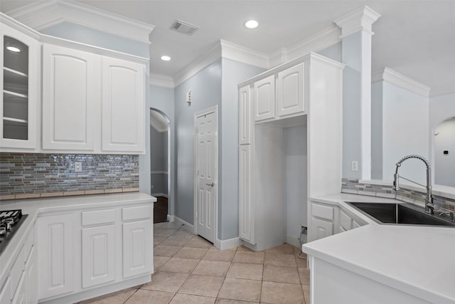 16503 Torry View Ter, Houston, TX 77095 - kitchen with a sink, tasteful backsplash, white cabinets, glass insert cabinets, and recessed lighting