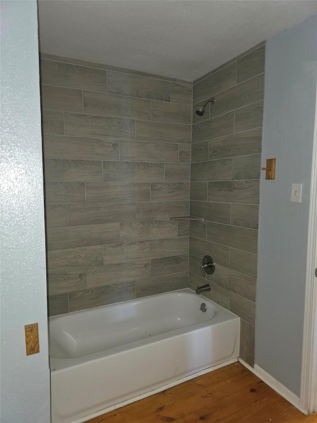 90 Oak Crest Dr, Shepherd, TX 77371 - bathroom with wood finished floors,  shower combination, and baseboards