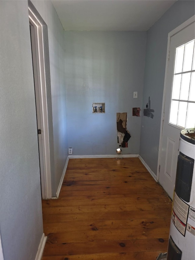 90 Oak Crest Dr, Shepherd, TX 77371 - washroom featuring electric water heater, hookup for a washing machine, wood finished floors, and baseboards