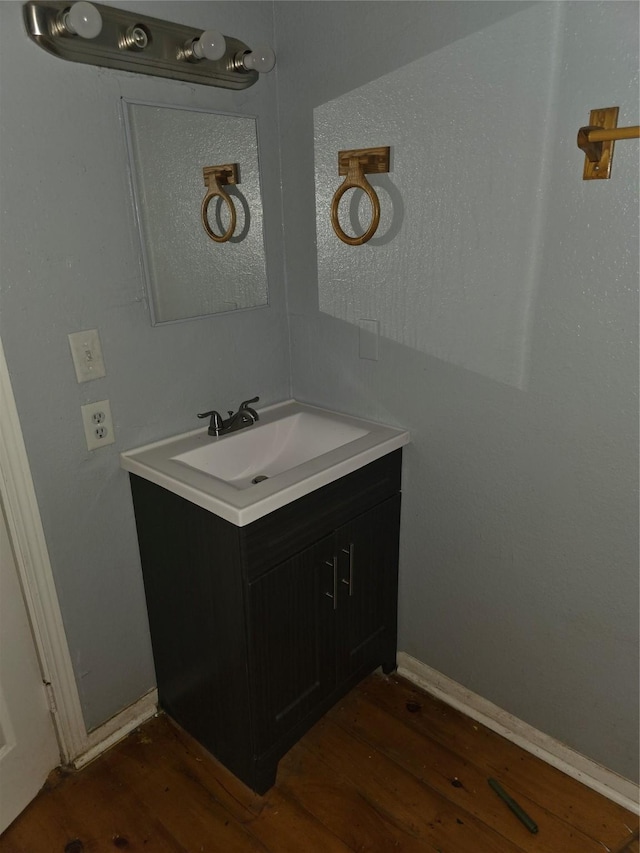 90 Oak Crest Dr, Shepherd, TX 77371 - bathroom featuring wood finished floors and vanity
