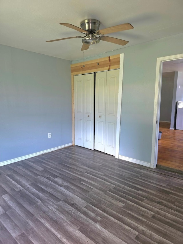 90 Oak Crest Dr, Shepherd, TX 77371 - unfurnished bedroom with baseboards, dark wood finished floors, a closet, and a ceiling fan