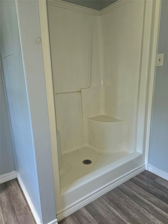 90 Oak Crest Dr, Shepherd, TX 77371 - bathroom with wood finished floors, baseboards, and a shower