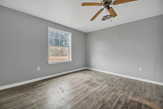 90 Oak Crest Dr, Shepherd, TX 77371 - empty room featuring wood finished floors, baseboards, and a ceiling fan