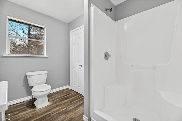 90 Oak Crest Dr, Shepherd, TX 77371 - bathroom with a shower, wood finished floors, baseboards, and toilet
