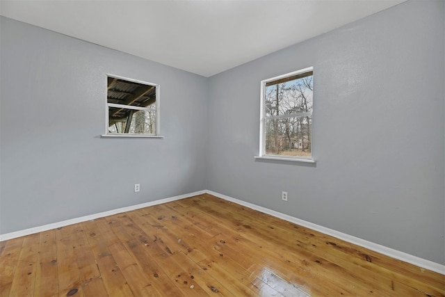 90 Oak Crest Dr, Shepherd, TX 77371 - unfurnished room featuring baseboards and hardwood / wood-style floors