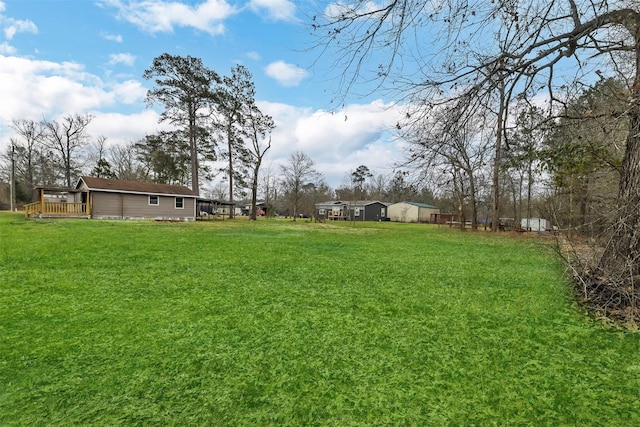 90 Oak Crest Dr, Shepherd, TX 77371 - view of grassy yard with a deck