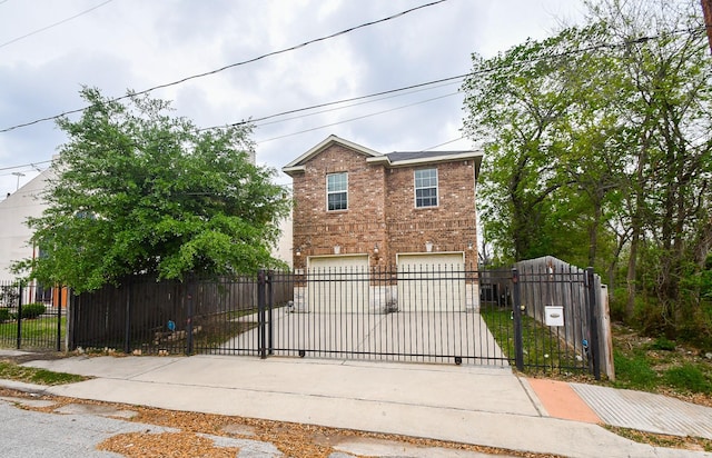 4915 Market St, Houston, TX 77020 - view of front of property featuring brick siding, concrete driveway, a garage, and a fenced front yard