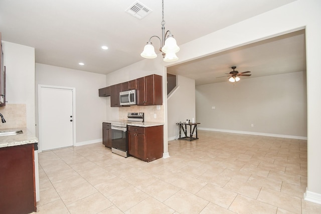 4915 Market St, Houston, TX 77020 - kitchen featuring appliances with stainless steel finishes, tasteful backsplash, a ceiling fan, a sink, and recessed lighting