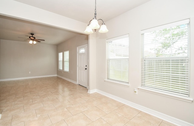 4915 Market St, Houston, TX 77020 - unfurnished room with a chandelier, a ceiling fan, and baseboards