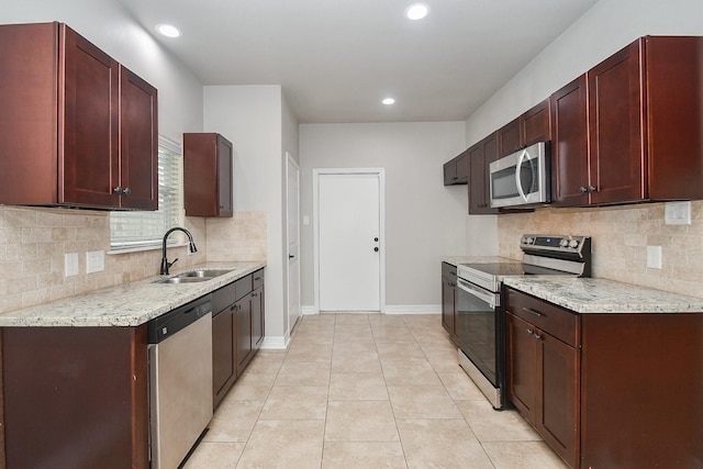 4915 Market St, Houston, TX 77020 - kitchen with stainless steel appliances, a sink, backsplash, baseboards, and recessed lighting