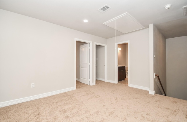 4915 Market St, Houston, TX 77020 - unfurnished bedroom featuring attic access, light colored carpet, baseboards, recessed lighting, and connected bathroom