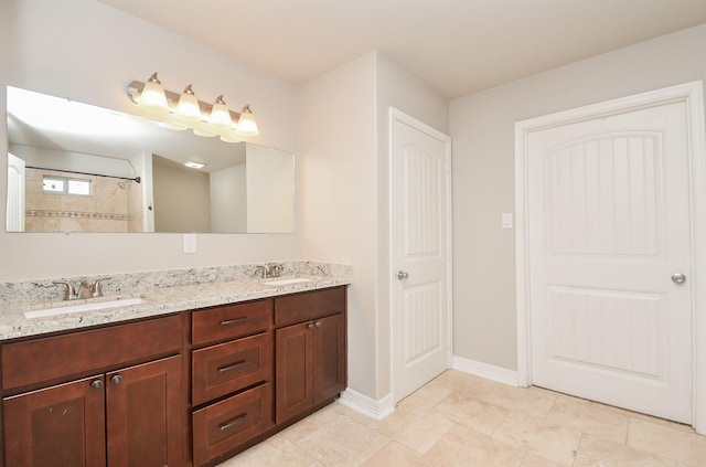 4915 Market St, Houston, TX 77020 - full bathroom with double vanity and baseboards