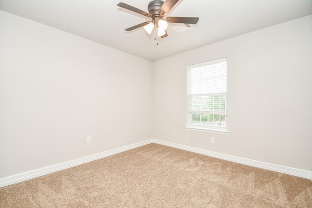 4915 Market St, Houston, TX 77020 - spare room with light colored carpet, baseboards, and ceiling fan