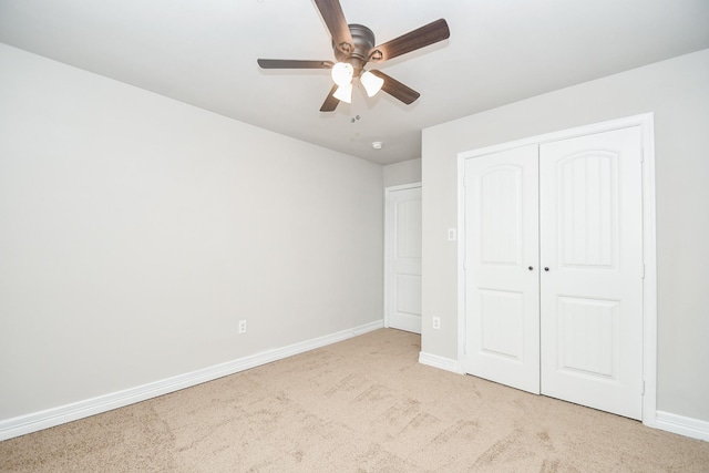 4915 Market St, Houston, TX 77020 - unfurnished bedroom with carpet, baseboards, a closet, and a ceiling fan