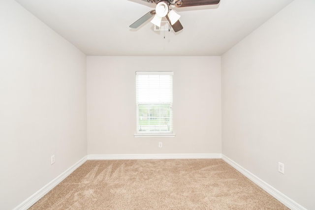 4915 Market St, Houston, TX 77020 - unfurnished room with light carpet, a ceiling fan, and baseboards
