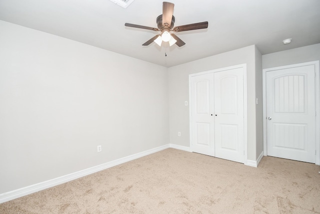 4915 Market St, Houston, TX 77020 - unfurnished bedroom featuring carpet, a closet, baseboards, and a ceiling fan