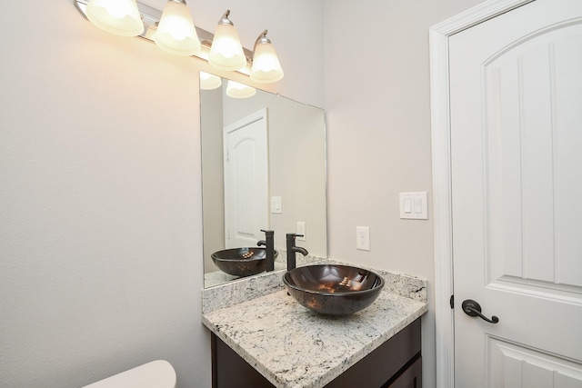 4915 Market St, Houston, TX 77020 - half bathroom featuring vanity and toilet