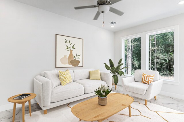 15786 Hickory, Montgomery, TX 77356 - living area featuring light marble finish flooring, recessed lighting, baseboards, and a ceiling fan