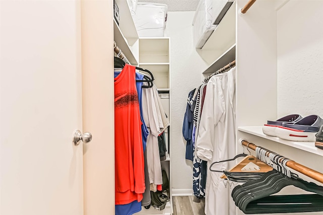 8111 Broadway St Unit 7, Galveston, TX 77554 - walk in closet featuring wood finished floors