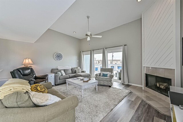 8111 Broadway St Unit 7, Galveston, TX 77554 - living area featuring wood finished floors, a tiled fireplace, baseboards, ceiling fan, and recessed lighting