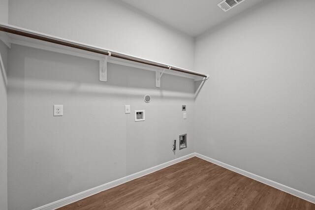 10902 Webber Ln, Texas City, TX 77591 - washroom with hookup for a gas dryer, hookup for an electric dryer, dark wood finished floors, hookup for a washing machine, and baseboards