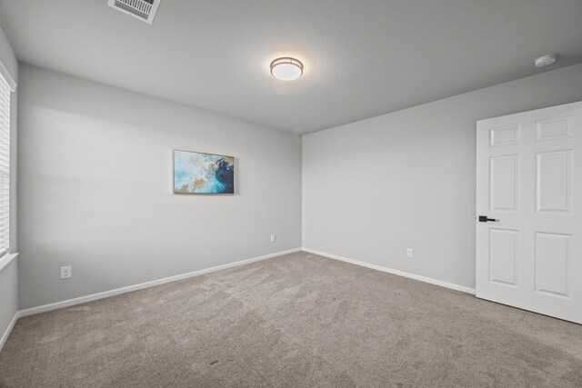 10902 Webber Ln, Texas City, TX 77591 - carpeted spare room featuring baseboards and a smoke detector