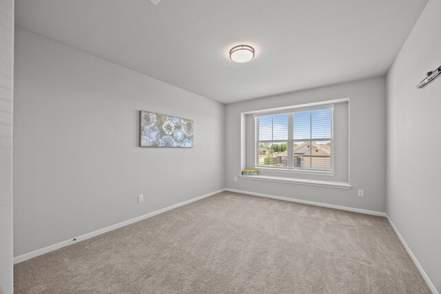 10902 Webber Ln, Texas City, TX 77591 - empty room featuring carpet and baseboards
