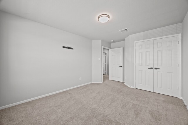 10902 Webber Ln, Texas City, TX 77591 - unfurnished bedroom featuring carpet flooring, baseboards, and a closet