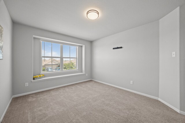 10902 Webber Ln, Texas City, TX 77591 - unfurnished room featuring carpet flooring and baseboards