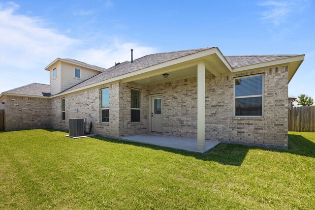 10902 Webber Ln, Texas City, TX 77591 - rear view of house featuring central AC, a patio, brick siding, and roof with shingles