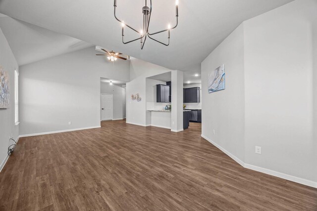 10902 Webber Ln, Texas City, TX 77591 - unfurnished living room featuring dark wood finished floors, baseboards, a chandelier, and high vaulted ceiling