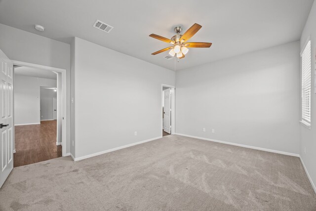 10902 Webber Ln, Texas City, TX 77591 - spare room featuring a ceiling fan, carpet, and baseboards