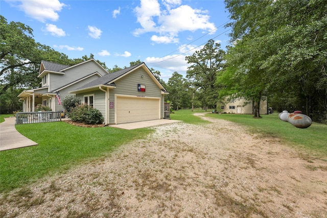 6803 E Treaschwig Rd, Spring, TX 77373 - view of home's exterior with a garage, driveway, a yard, and covered porch