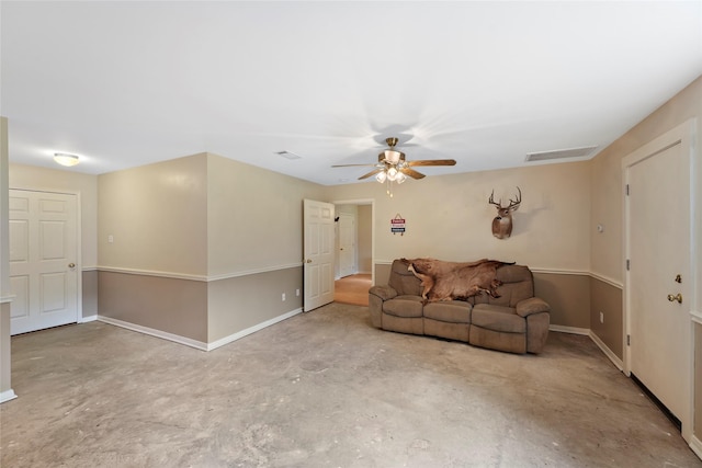 6803 E Treaschwig Rd, Spring, TX 77373 - living area with unfinished concrete floors, ceiling fan, and baseboards