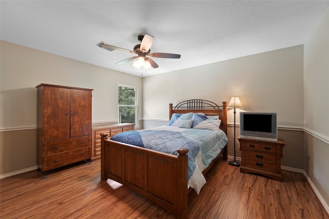 6803 E Treaschwig Rd, Spring, TX 77373 - bedroom featuring wood finished floors, baseboards, and ceiling fan