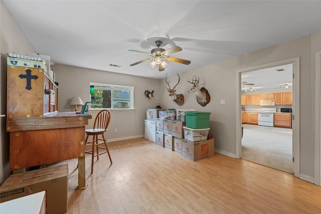 6803 E Treaschwig Rd, Spring, TX 77373 - office space featuring ceiling fan, light wood finished floors, and baseboards