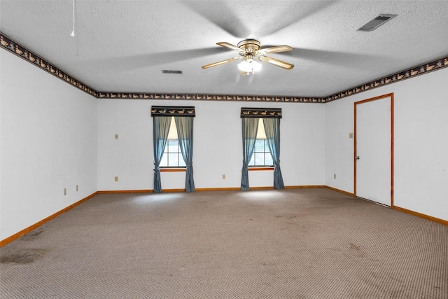 24614 Spruce, Huntsville, TX 77320 - carpeted empty room with a ceiling fan, baseboards, and a textured ceiling