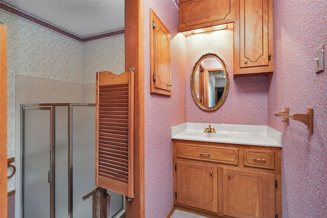 24614 Spruce, Huntsville, TX 77320 - full bath with a stall shower, wallpapered walls, and vanity