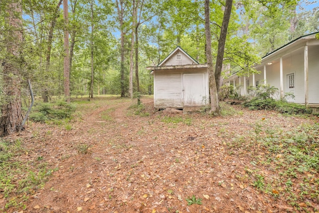 24614 Spruce, Huntsville, TX 77320 - view of yard with a storage shed and an outdoor structure