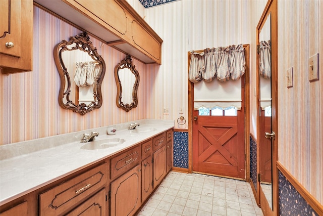 24614 Spruce, Huntsville, TX 77320 - bathroom featuring wallpapered walls and double vanity