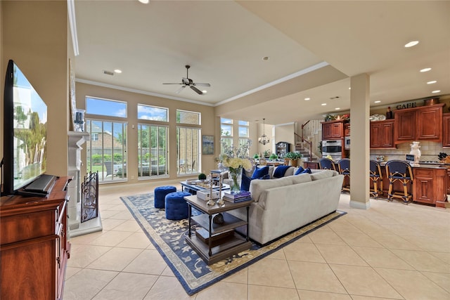 11310 Stonecreek Bend Ln, Cypress, TX 77433 - living room featuring light tile patterned flooring, crown molding, ceiling fan, and recessed lighting