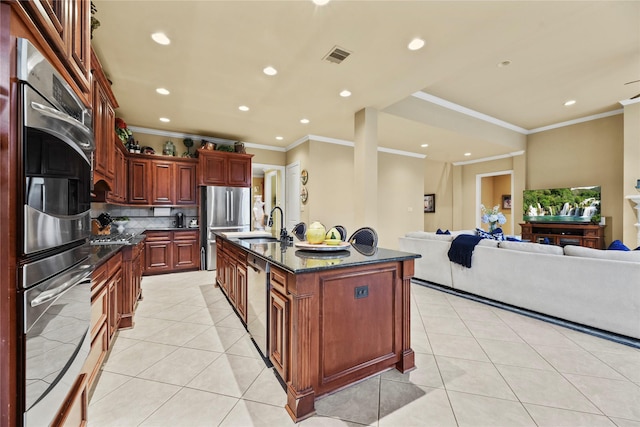 11310 Stonecreek Bend Ln, Cypress, TX 77433 - kitchen with stainless steel appliances, light tile patterned floors, open floor plan, recessed lighting, and a sink