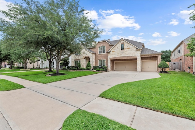 11310 Stonecreek Bend Ln, Cypress, TX 77433 - view of front of house featuring driveway and stone siding
