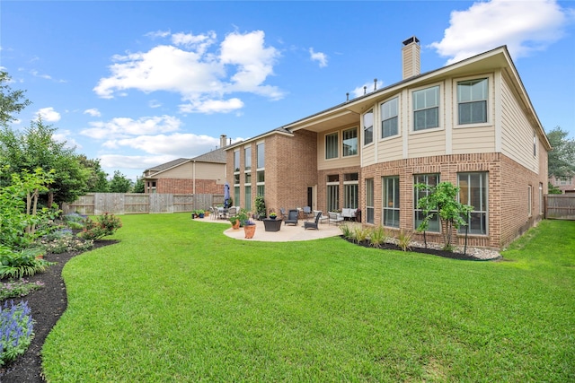 11310 Stonecreek Bend Ln, Cypress, TX 77433 - rear view of property with a chimney, a patio area, and brick siding