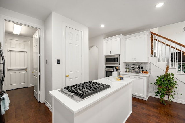 14742 Timbergreen Dr, Magnolia, TX 77355 - kitchen featuring stainless steel appliances, dark wood-style floors, white cabinetry, and recessed lighting
