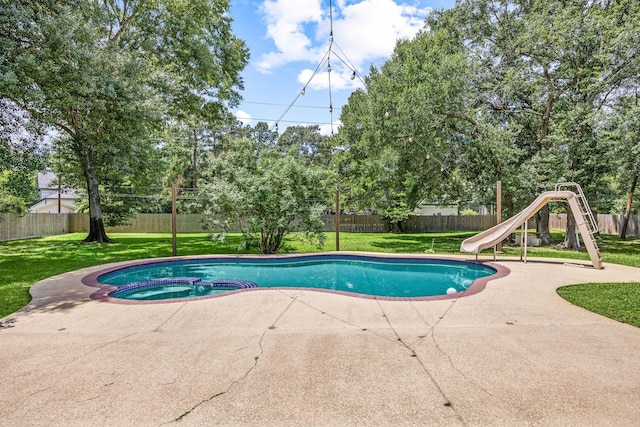 14742 Timbergreen Dr, Magnolia, TX 77355 - view of pool with a water slide, a patio, a pool with connected hot tub, and a playground